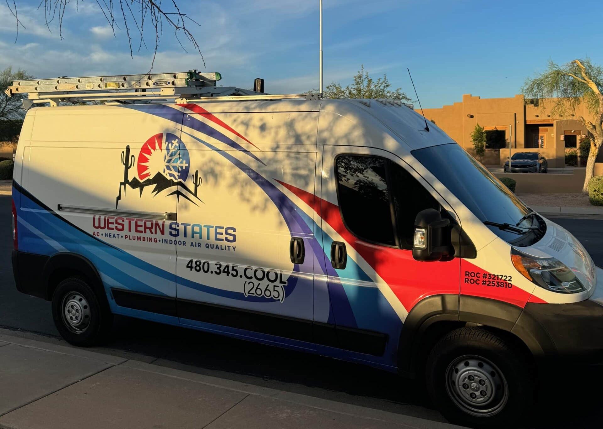 Western States plumbing & HVAC van next to sidewalk